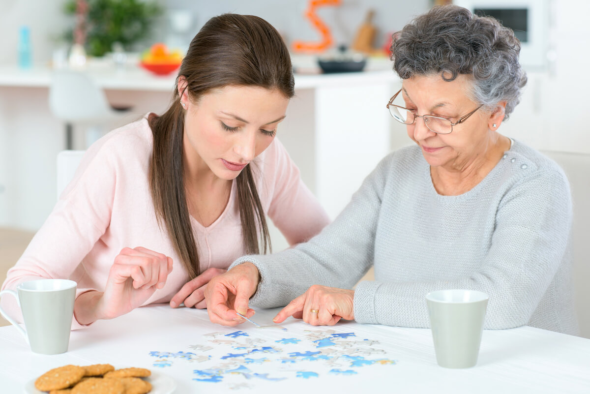 Buda Oaks | Two People Doing a Puzzle Together
