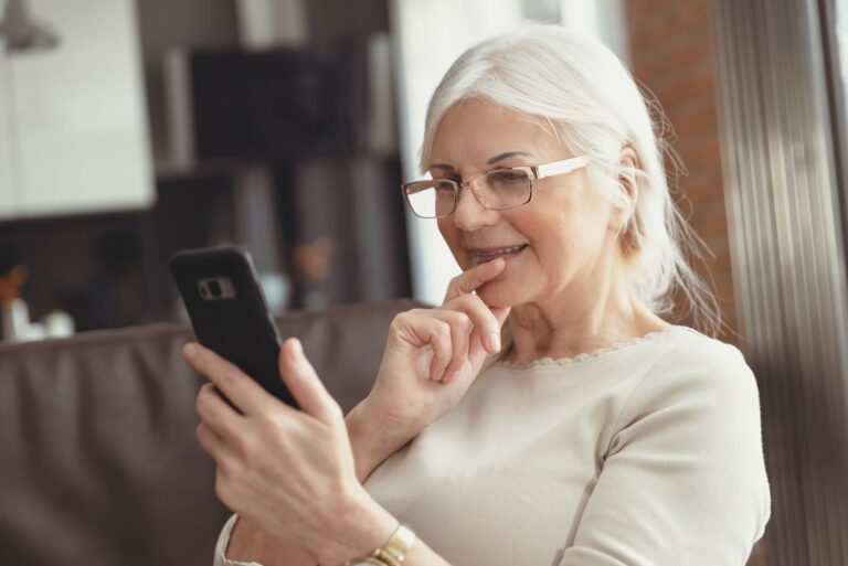 Buda Oaks | Senior looking at her phone