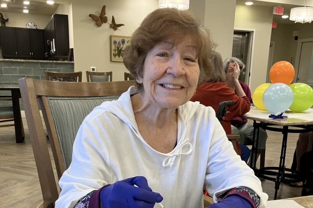 Buda Oaks | Senior resident making a donut