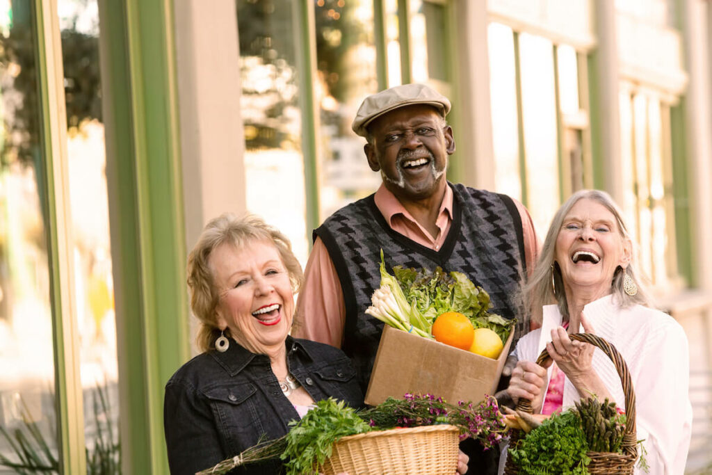 Buda Oaks | Group of seniors shopping at the farmers market